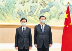 习近平会见李家超 韩正参加会见